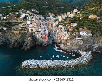 View from above, stunning aerial view of Riomaggiore during a beautiful sunset. Riomaggiore is the most picturesque and the first village of the Cinque Terre coming from La Spezia, Liguria, Italy.