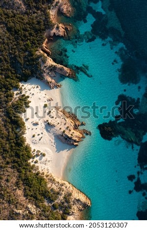 View from above, stunning aerial view of Spargi Island with Cala Soraya, a white sand beach bathed by a turquoise water. La Maddalena archipelago National Park, Sardinia, Italy.