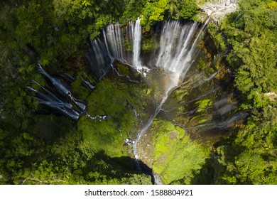 View from above, stunning aerial view of the Tumpak Sewu Waterfalls also known as Coban Sewu. Tumpak Sewu Waterfalls are a tourist attraction in East Java, Indonesia. - Powered by Shutterstock