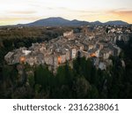 View from above, stunning aerial view of the village of Vitorchiano at sunset. Vitorchiano is a medieval Italian village in Viterbo Province, Lazio, Italy.	