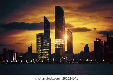 View of Abu Dhabi Skyline at sunset, United Arab Emirates, special photographic processing. 