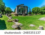 A view across the area surrounding the council meeting building in the Roman ruins of Apollonia in Albania in summertime