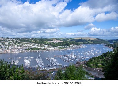 A view across the River Dart towards the town of Dartmouth from the village of Kingswear on the north side of the river showing the marina.