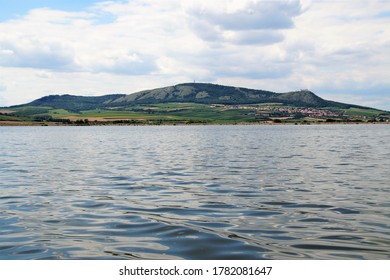 view across the water surface to the Pálava hills