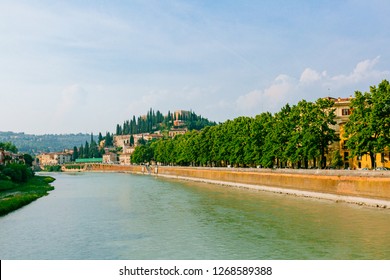 View of the Adige river and Castel San Pietro on top of hill, in Verona, Italy - Shutterstock ID 1268589388