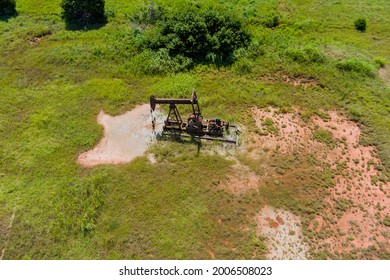 View Aerial Pump Jack In A Canola Field In Oklahoma An Oil Well Pump Jack Pumping Crude Oil Fuels