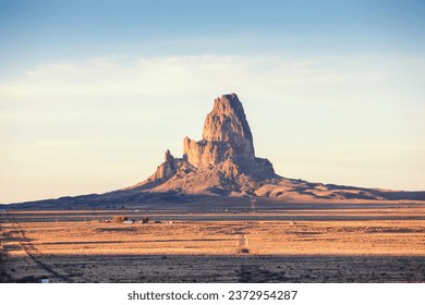 View of Agathla Peak in light of the setting sun, south of Monument Valley, Arizona, United States.
