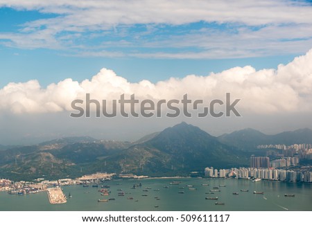 View from airplane window above the cloud over Hong Kong island international  airport