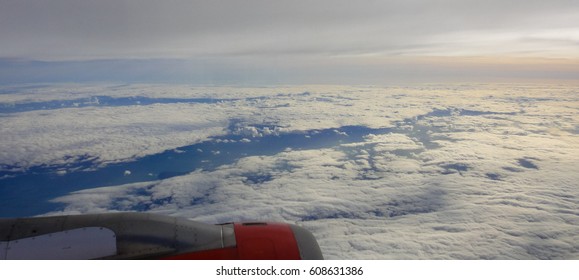 View from the airplane window to the clouds during a flight over Gibraltar