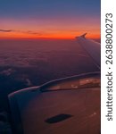 The view from a airplane window to clouds and sunset.