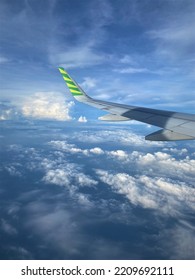 View Of An Airplane Wing With Bright Blue Sky In The Morning Flight