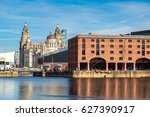 View of Albert Dock and Three Graces building in Liverpool in a beautiful summer day, England, United Kingdom