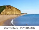 View along the beach and Jurassic Coast coastline, West Bay, Dorset, UK, Europe.