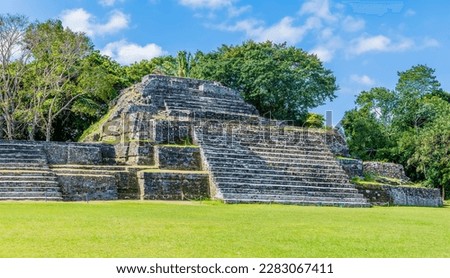 A view along the far side of the first plaza in the ancient Mayan city ruins of Altun Ha in Belize on a sunny day