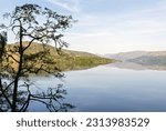 View along Loch Katrine all the way to the Arrochar mountains. Loch Lomond and the Trossachs National Park, Southern Highlands of Scotland.