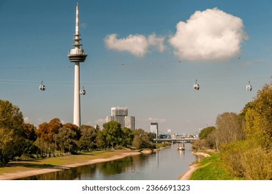 View along the Neckar river to the telecommunications tower in Mannheim, Baden-Wuerttemberg