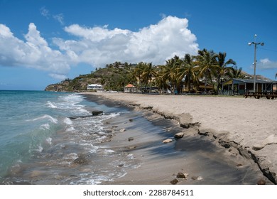 A view along the sandy Caribbean beach of Frigate Bay