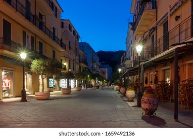View along typical Italian narrow street in Alassio old town, Liguria region