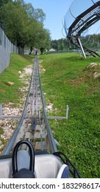 View Of Alpine Coaster Going Up On Tracks. Sarajevo, Mountain Trebevic.