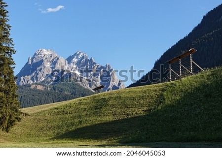 Similar – Foto Bild Young woman on the balcony who enjoys the view of the mountains