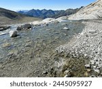 View of alpine river with crystalline water in the famous Alta Via di Neves, Alto Adige, Italy