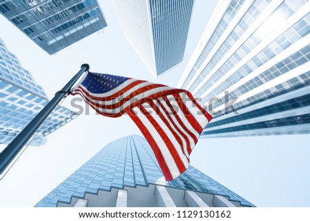View of American flag on blue building background