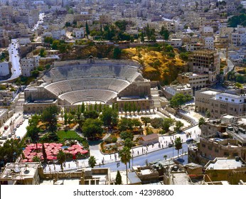 View At Amman The Captal Of Jordan,with The Roman Amphitheatre. No Number Plates,no Brands And No People Recognizable