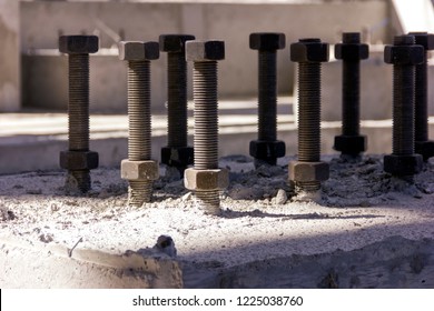 View Of The Anchor Bolts For Fondation In The Concrete. An Anchor Bolt Is A Fastener Used To Attach Objects Or Structures To Concrete. There Are Many Types Of Anchor Bolts.