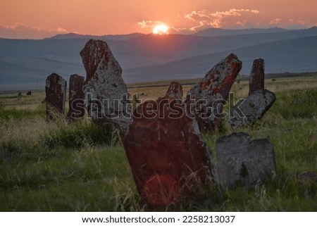 View of the ancient burial mounds and menhirs in the steppes and mountains of Khakassia, Russia.