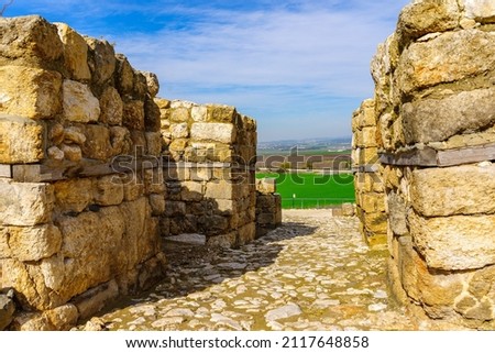 View of an ancient Canaanite gate, and landscape, in Tel Megiddo National Park, Northern Israel