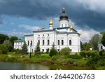 View of the ancient Cathedral of the Three Saints (1574) in the Spaso-Eleazarovsky Monastery on a June day. Elizarovo, Pskov Region, Russia