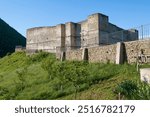 View of the ancient fortress of the Seven Brothers and One Sister on a sunny May morning. Khuchni. Republic of Dagestan