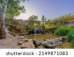 View of the ancient Kantar bridge, over the Harod Stream, with Eucalyptus trees, in the Lower Jordan River valley, Northern Israel