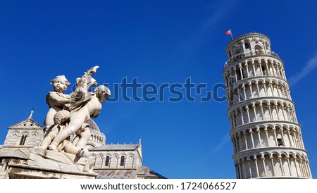 View of an ancient sculpture in front of the Pisa Cathedral (Duomo di Pisa) in Pisa, Italy. It is located in Miracoli Square (Piazza dei Miracoli).