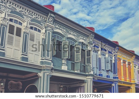 View of the ancient unique windows of Georgetown, Malaysia. Beautiful houses exterior on a street. Historic architecture. Typical view of the street with colourful houses.