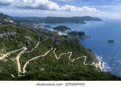 View from Angelo kastro castle (Corfu, Greece). Monastery of Paleokastritsa and Agios Spiridon beach can be seen. Winding field road directly to the small beach. 