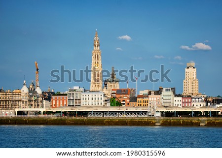 View of Antwerp over the River Scheldt with Cathedral of Our Lady Onze-Lieve-Vrouwekathedraal Antwerpen, Belgium.
