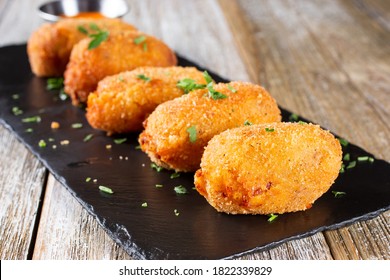 A view of an appetizer plate of croquettes. - Shutterstock ID 1822339829