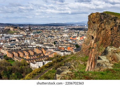 A view from Arthur's Seat to the Salisbury Crags with Edinburgh in the background  - Shutterstock ID 2206702363
