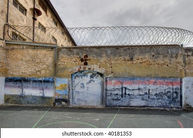 View of artwork in the exercise yard of an old prison. This is a high dynamic range (HDR) image.