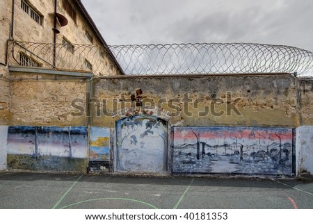 View of artwork in the exercise yard of an old prison. This is a high dynamic range (HDR) image.