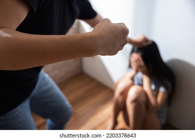 View Of Asian Man Beating Up His Wife For Domestic Violence Concept