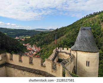 A view from atop a castle towering over the hills of central Europe. 