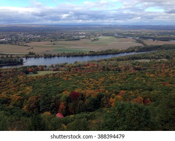 The view from atop Mount Holyoke in Western Massachusetts includes the Connecticut River and autumn leaves beginning to show colors.