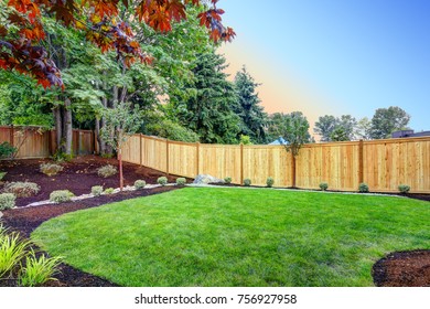 View of an attractive backyard with new planting beds and well kept lawn. Northwest, USA - Shutterstock ID 756927958