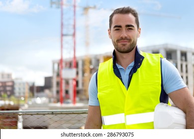 View of an attractive worker on a construction site 