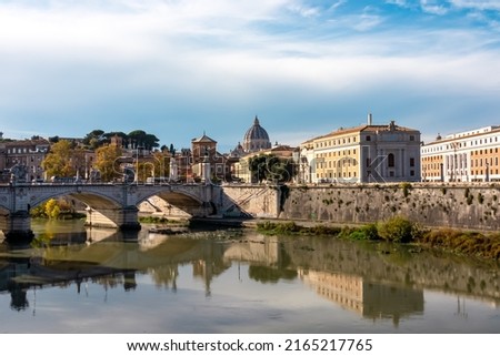View from Aurelius Bridge (Ponte Sisto Bridge) on St Peters Basilica in Vatican during daytime. Stone bridge Sant Angelo over river Tiber. Skyline in the city of Rome, Lazio, Europe, EU. Reflection