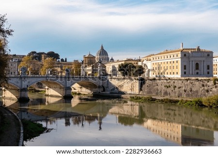 View from Aurelius Bridge (Ponte Sisto Bridge) on St Peters Basilica in Vatican during daytime. Stone bridge Sant Angelo over river Tiber. Skyline in the city of Rome, Lazio, Europe, EU. Reflection