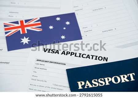 View of Australia visa application form with passport and national flag.