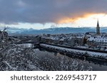 View of the Austrian city of Villach in the federal state of Carinthia, against the backdrop of the snow-capped Alps, the Karawanken ridge, at sunset